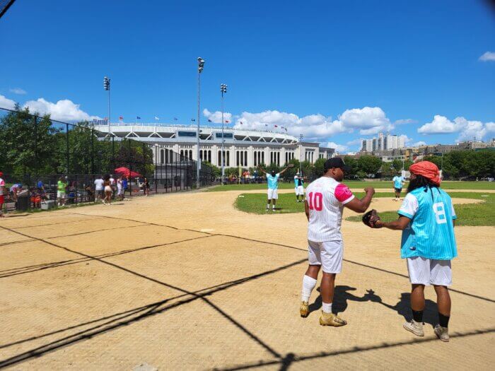 Players cheer during the annual Celebrity Charity Softball Game outside Yankee Stadium on Sunday, July 30, 2023. 