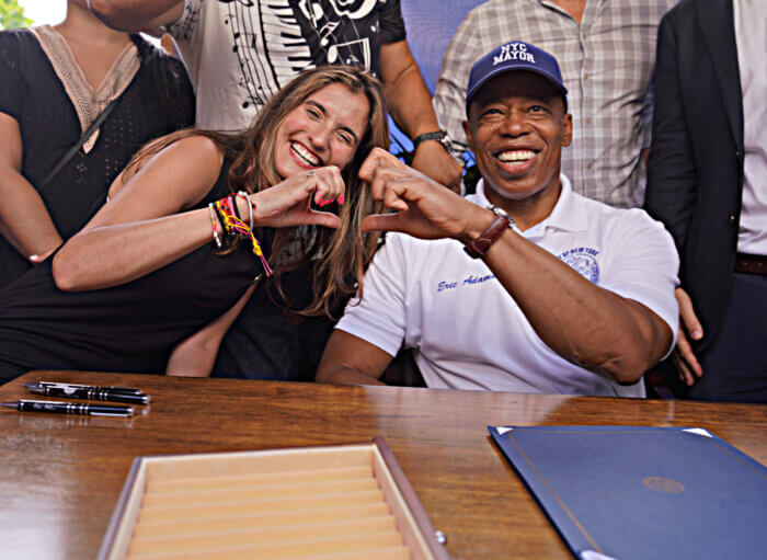 Bronx City Councilmember Marjorie Velázquez is pictured with Mayor Eric Adams as he signs the "Dining Out NYC" legislation on Wednesday, Aug. 16, 2023.