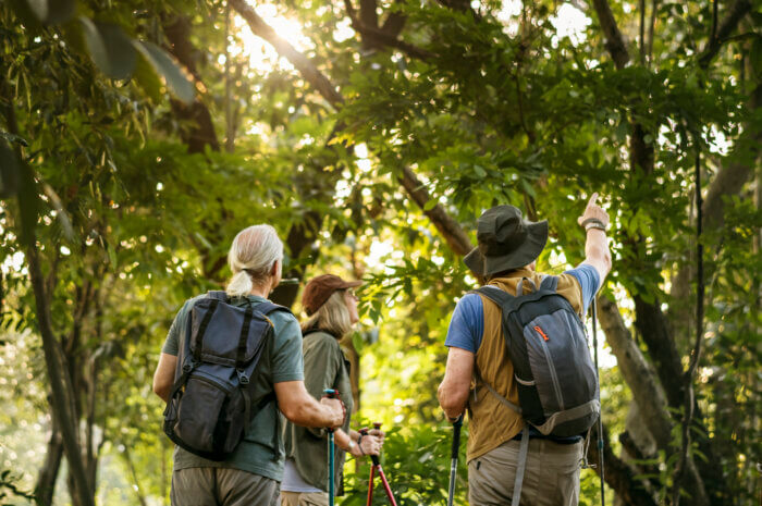 Matthew López-Jensen is leading a walk through Mosholu Park to discuss how to keep an urban forest healthy on Aug. 12, 2023.