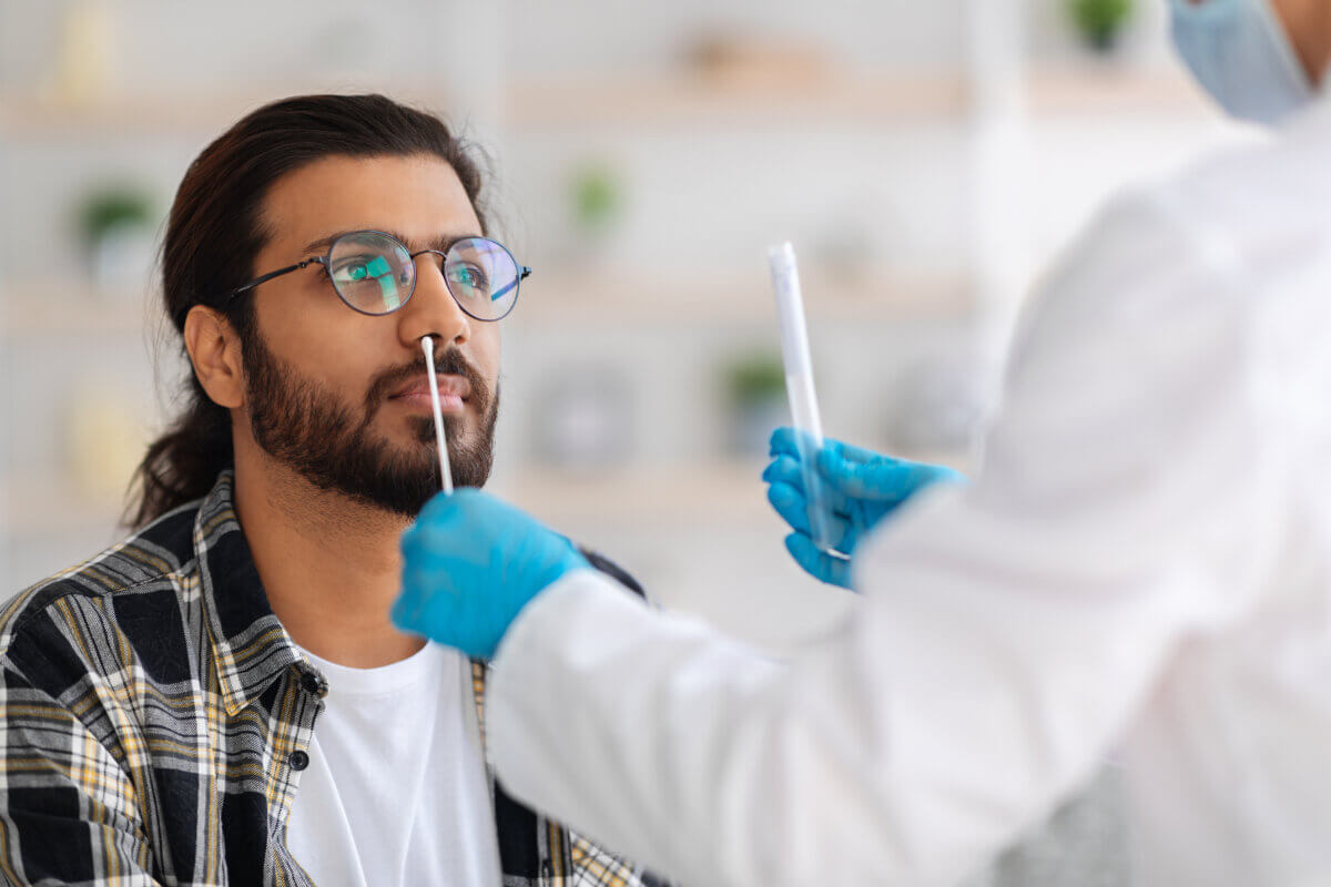 stock photo of man getting tested for COVID-19