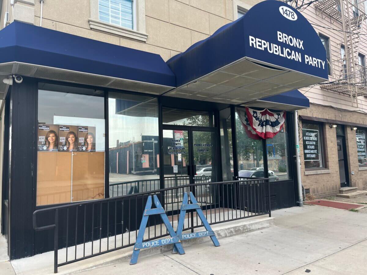 The Bronx GOP office windows are seen boarded up after a person threw a metal trash can through the glass on Wednesday, Aug. 9, 2023.