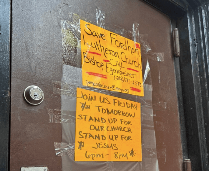 The fight to save Fordham’s Evangelical Lutheran Church continues amid candlelight vigil, talk