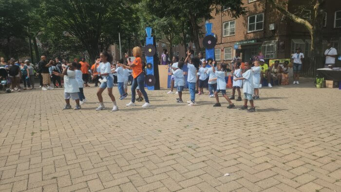 More than 700 residents participated in a community-wide picnic featuring barbeque, music, fun activities for residents of all ages and a book bag giveaway for children heading back to school in the fall. Local children also performed a tribute to the 50th anniversary of hip-hop as part of the event.