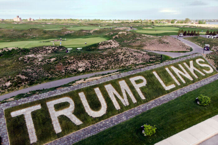 sign saying Trump Links in front of golf course