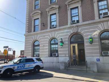 Police cars are parked outside the 45th Precinct in Throggs Neck on April 21, 2023.