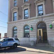 Police cars are parked outside the 45th Precinct in Throggs Neck on April 21, 2023.
