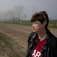 Radio Diaries and Radiotopia are launching a new podcast called "The Unmarked Graveyard: Stories from Hart Island." Pictured, Susan Hurlburt visits her son's grave on the island.