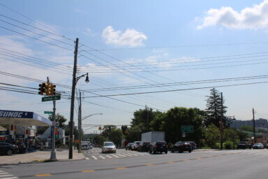 People cross the East Gun Hill Road and Bartow Avenue intersection in the East Bronx on Tuesday, July 25, 2023.