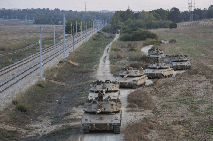 Israeli tanks move near the Israeli Gaza border, Israel on Wednesday, Oct. 11, 2023.