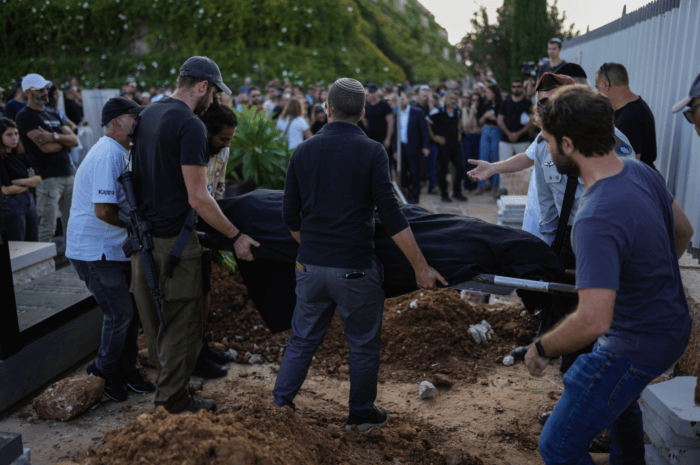 Mourners carry the body of Mapal Adam, during her funeral in Tel Aviv, Israel, on Wednesday, Oct. 11, 2023. Adam was killed by Hamas militants on Saturday as they carried out an unprecedented, multi-front attack that killed over 1,000 Israelis.