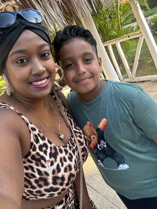Sandy Motie snaps a selfie with her youngest son Jayce Gomez, 8, in the Dominican Republic in September 2023. 