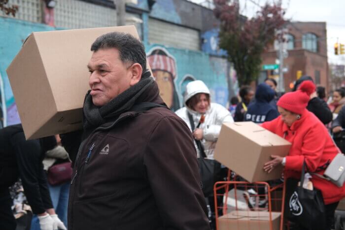 “We're helping out for Thanksgiving and the families in the local area,” said manager of the facilities and automation team at Baldor Specialty Foods Krenar Jusufi. “I think it's really important that we give back as much as we can to the community.” Jusufi brought his two children to help in setting up and distributing the free meal kits.