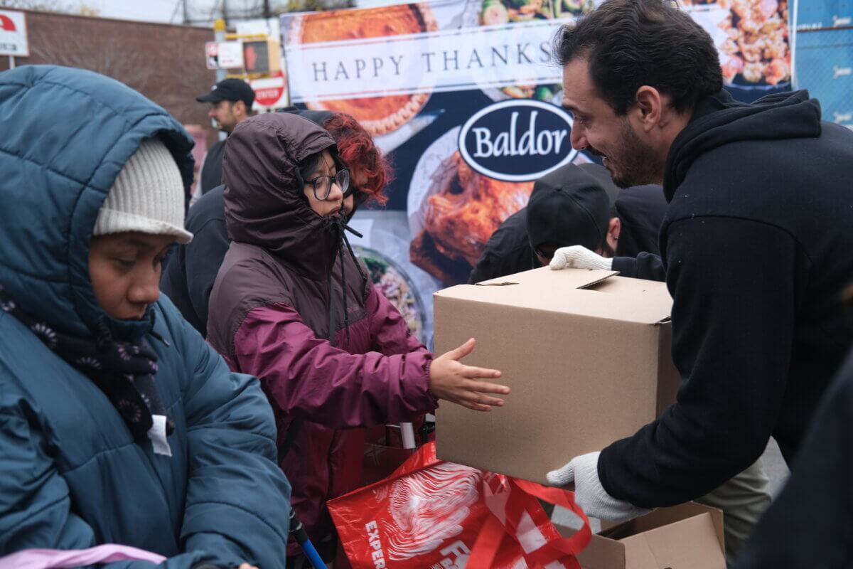 Boxes of fresh vegetables, fruits, and other food products are freely distributed to the community during Baldor Specialty Foods’ 9th annual Thanksgiving giveaway on Saturday, Nov. 18, 2023.