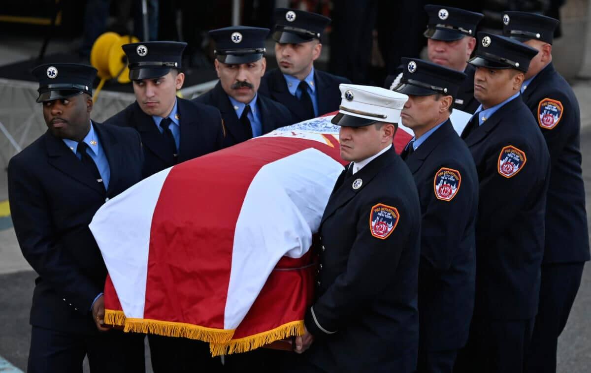 Paulbears carry the casket of fallen EMT Frederick Whiteside.