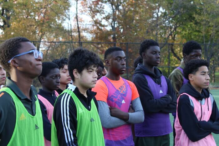 Kids take a break from their soccer practice in Crotona Park on Wednesday, Nov. 8, 2023 during their surprise visit from NYCFC defender Tayvon Gray.