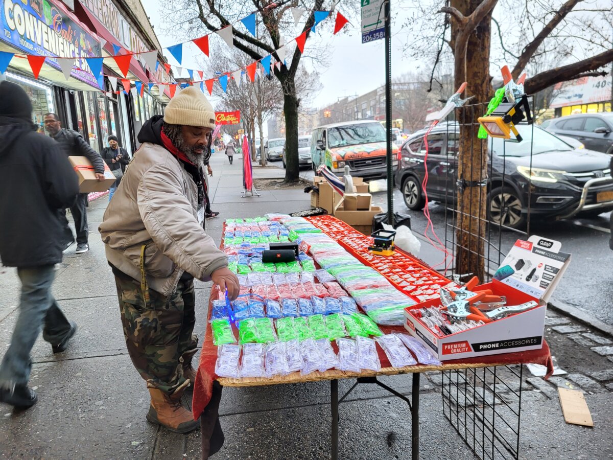 Larry Taylor, a disabled Vietnam veteran, wants to vend on Allerton Avenue and White Plains Road -- but is battling DSNY over licensing issues. Enforcement comes through so regularly that he always keeps backup merchandise nearby. Photo Emily Swanson