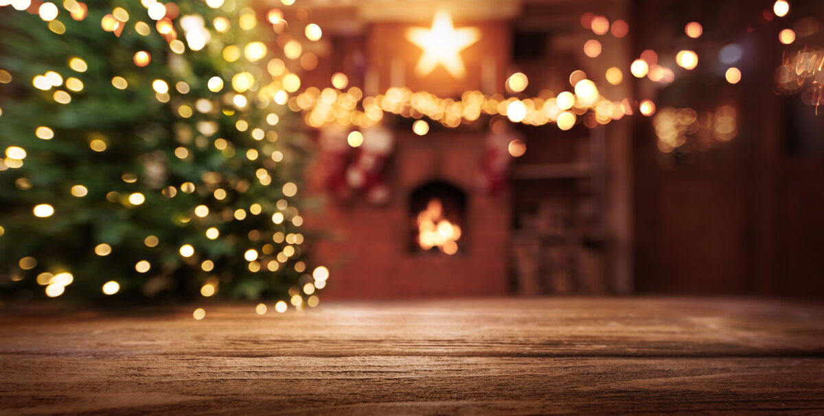 Christmas Tree With Illumination Near the Fireplace. Home Decor