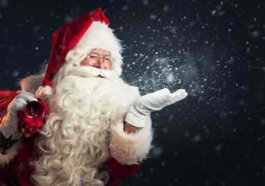 Santa Claus blowing magic snow of his hands