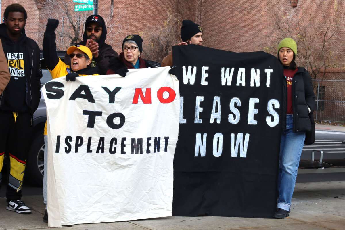 People protest potential small business evictions along Kingsbridge Road and Jerome Avenue in the Bronx on Thursday, Dec. 7, 2023.
