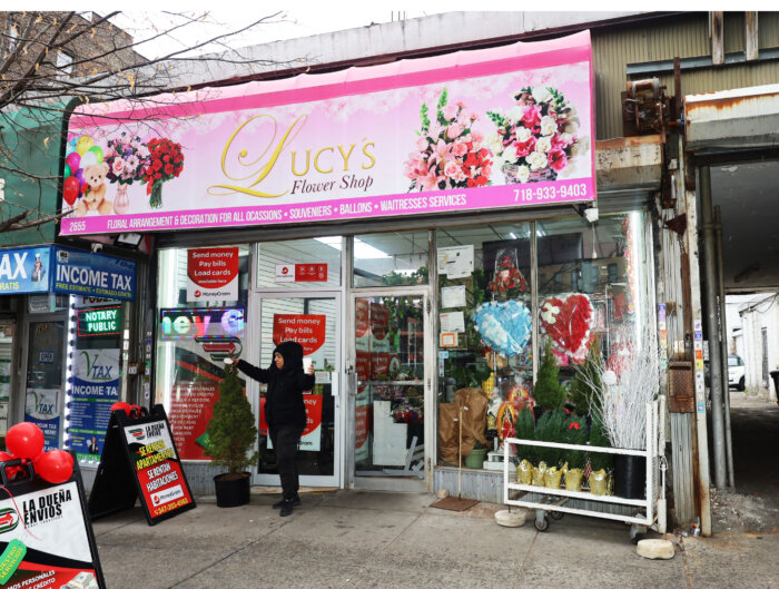 People shop at Lucy's Flower Shop on Thursday, Dec. 7, 2023. The shop, which has been selling flowers to the Kingsbridge community for 28 years, is in jeopardy of eviction due to proposed redevelopment of the Kingsbridge Armory. 