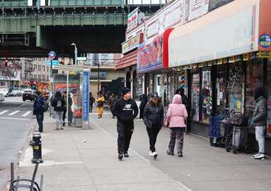 Locals walk along Kingsbridge Road near Jerome Avenue on Thursday, Dec. 7, 2023.