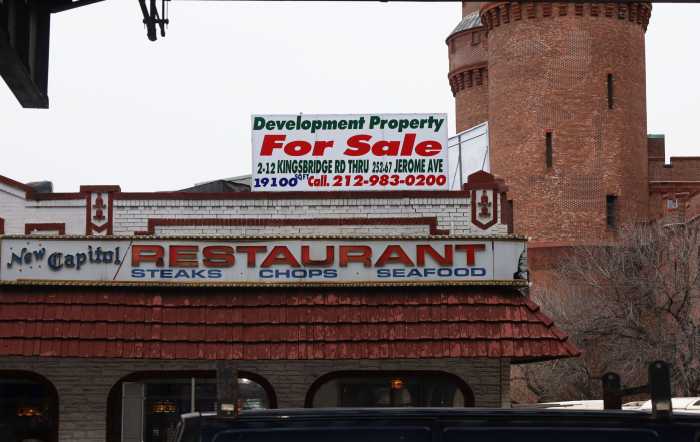 A "for sale" sign looms above the New Capitol Restaurant at 2 Kingsbridge Road on Thursday, Dec. 7, 2023, which has been serving the neighborhood Hispanic and diner classics for 55 years.