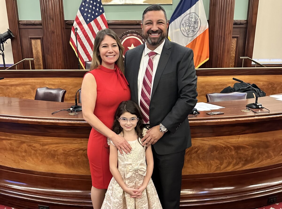 New York City Council Member-elect Kristy Marmorato, right, is sworn in at City Hall alongside her husband Gino Marmorato and 7-year-old daughter Renata on Wednesday, Dec. 6, 2023.