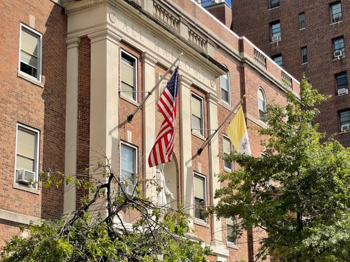 Flags decorate the exterior of All Hallows High School in the South Bronx.