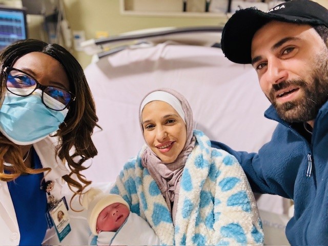 Montefiore's first baby of the new year, Adam Alshawabkeh, born on Jan. 1, 2024, is pictured alongside hospital medical staff and his parents Fatima Alshawabkeh and Omar Ali Hamdan Alrawashdeh.