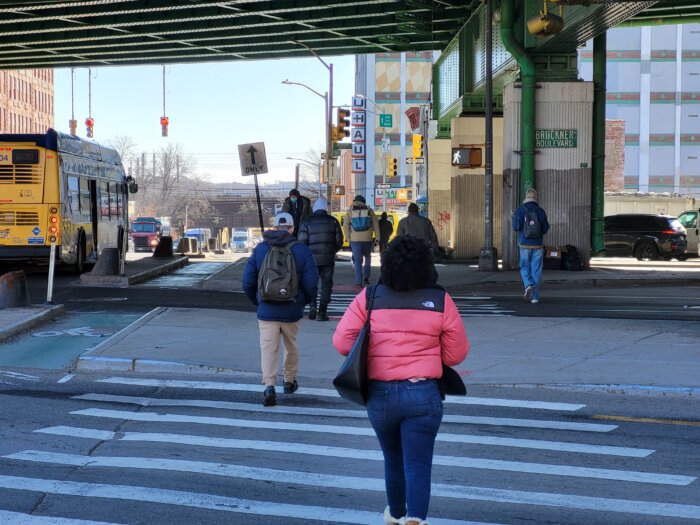 Pedestrians navigate East 138th Street between Cypress Avenue and Bruckner Boulevard on Feb. 6, 2024. East 138th was identified by the nonprofit Transportation Alternatives as one of the most dangerous streets in the city for those who drive, bike or walk.