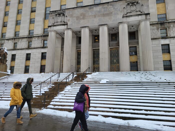 People walk by Bronx Borough Hall on Tuesday, Feb. 13, 2024.