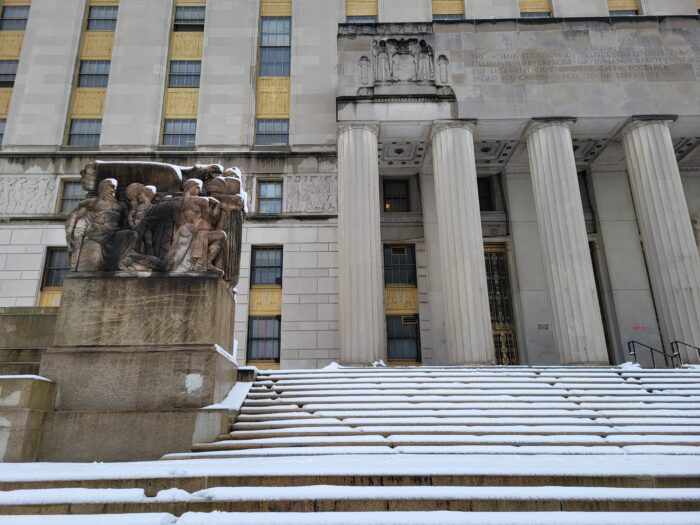 Snow falls on the steps of Bronx Borough Hall on Tuesday, Feb. 13, 2024.