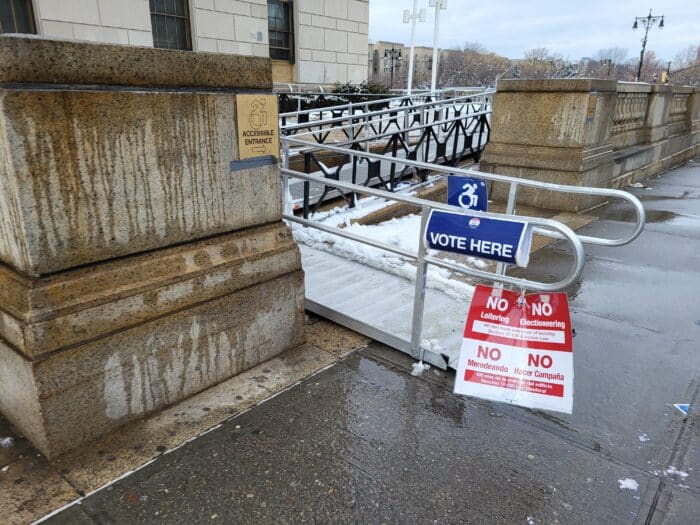 Signs usher voters into their polling site on Tuesday, Feb. 13, 2024.