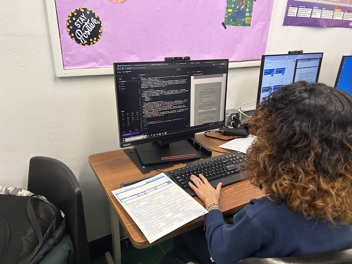 A student at St. Catharine Academy works on computer science coursework.