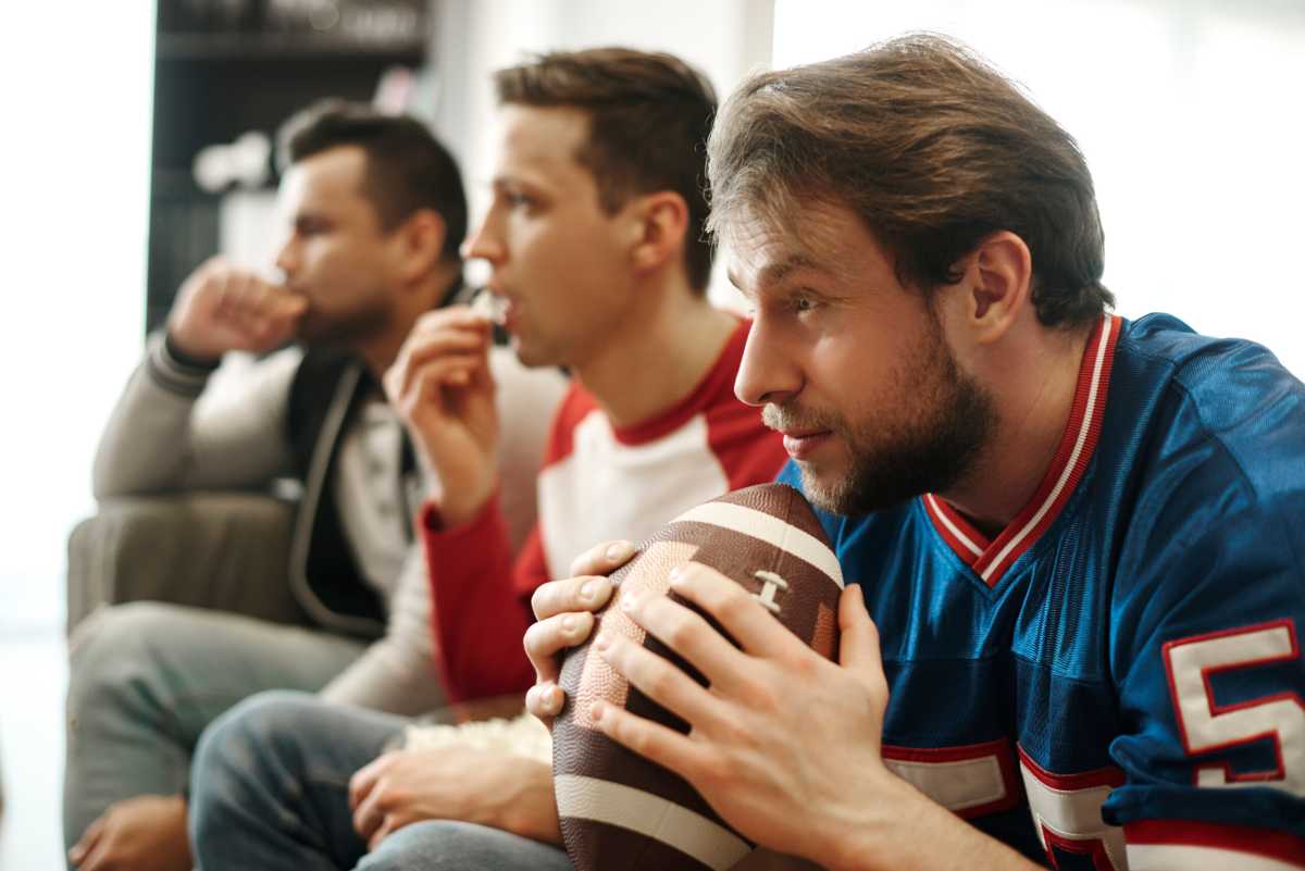Focused watching football game at home