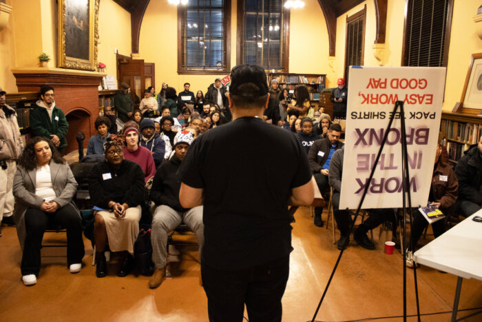 Josué Caceres, Founder and CEO of BX Writers speaking to attendees present. Caceres is a published poet and creative.