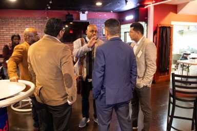 Attendees converse at the State of Climate Tech mixer.
