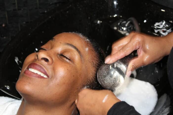 Kerene Edie gets her hair washed, trimmed and styled at Hair By Dee in Van Nest on Tuesday, Feb. 20, 2024.