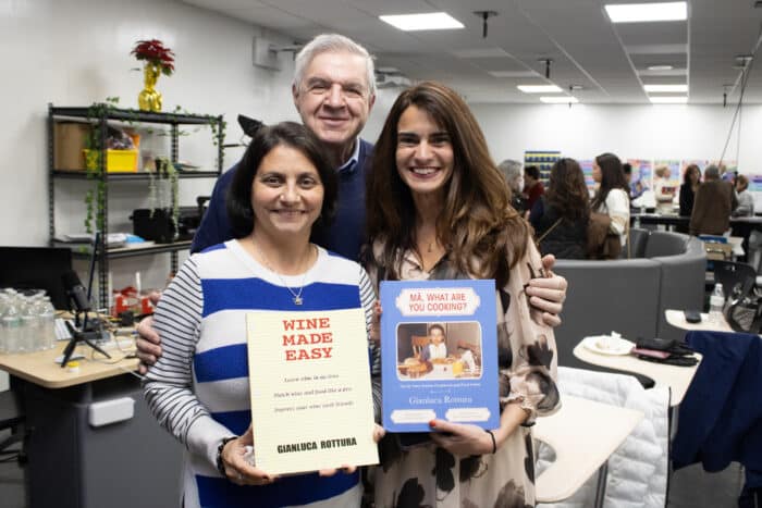 Former and past presidents of FIAME hold two of Gianluca Rottura's books. In this photo is Rosa Leoncini, president of FIAME, Anthony Lentini, past president of FIAME, and Rosemary Mercora, past president of FIAME.