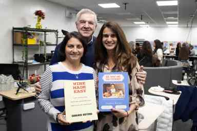 Former and past presidents of FIAME hold two of Gianluca Rottura's books. In this photo is Rosa Leoncini, president of FIAME, Anthony Lentini, past president of FIAME, and Rosemary Mercora, past president of FIAME.