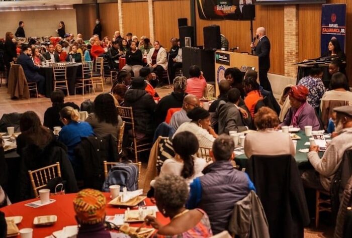 Community members gather together as Councilmember Salamanca gives a speech at the Black History Month celebration.