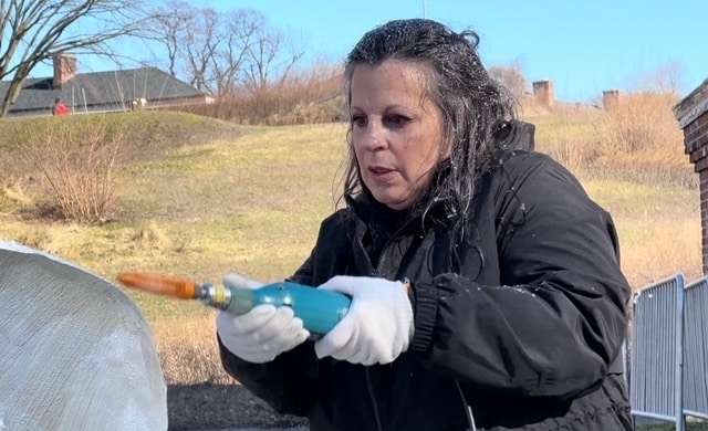 Lovie Pignata carved her ice sculpture, 'Smitten', in a two-hour period. The Governors Island Ice Sculpture Show is a free event where community members can come to watch the live ice carving.