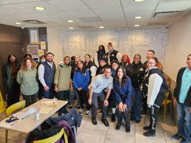Students and others pose at the McDonald's where the art contest was held.