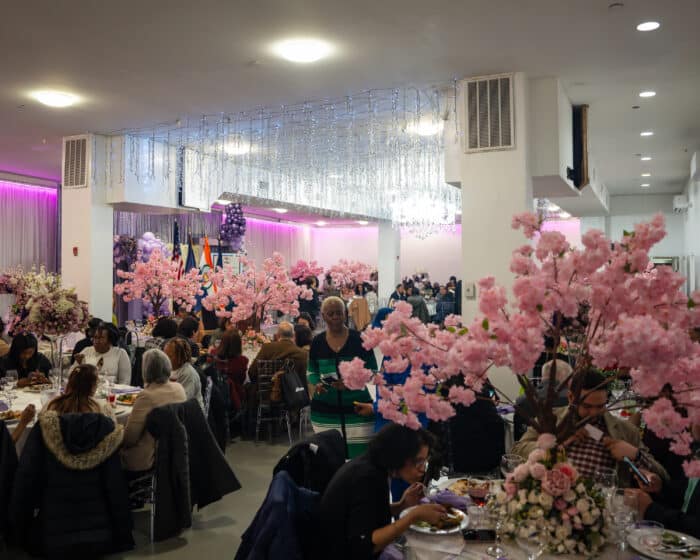 Guests eat food during the celebration, where women were honored with awards from Bronx Borough President Vanessa L. Gibson.