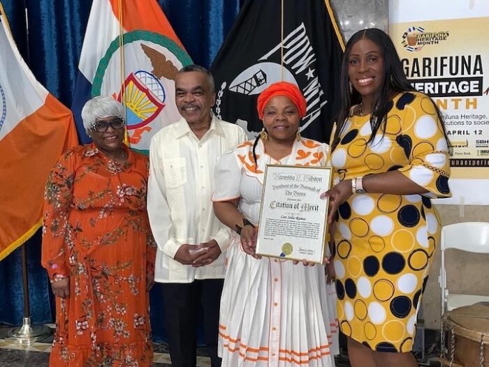 Borough President Vanessa L. Gibson stands with recipients of a citation of merit at the event.