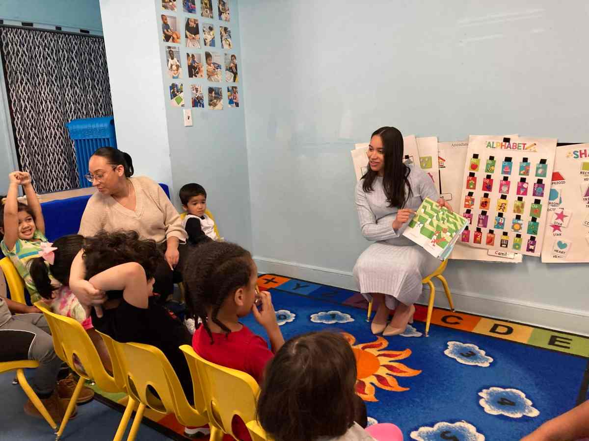 Children listen as a story is read to them during Read Across America Day.