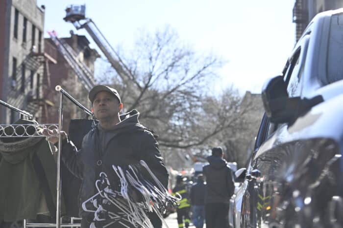 Tenants take to the streets after a fire in Marble Hill on Monday, March 11, 2024.