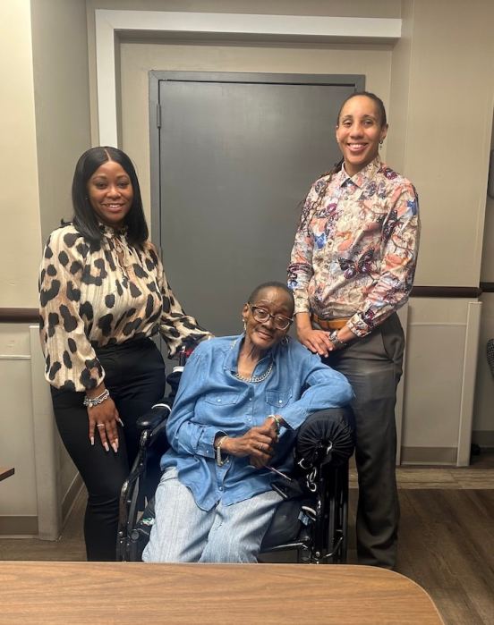 (L-R) Maya Clarke, Karen Reid and Monique Sampson pose for a photo at the Williamsbridge Center nursing home.