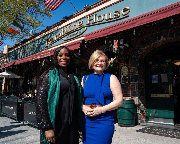 Gibson and Nolan smile outside the Rambling House during their tour of Woodlawn.