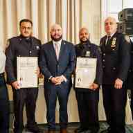 Councilmember Rafael Salamanca, Jr. stands with a few of the honorees at the Heroes Recognition Breakfast.